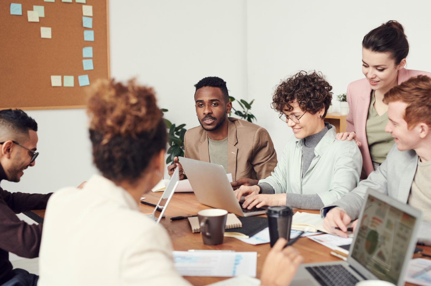 Photo of six colleagues meaningfully working together