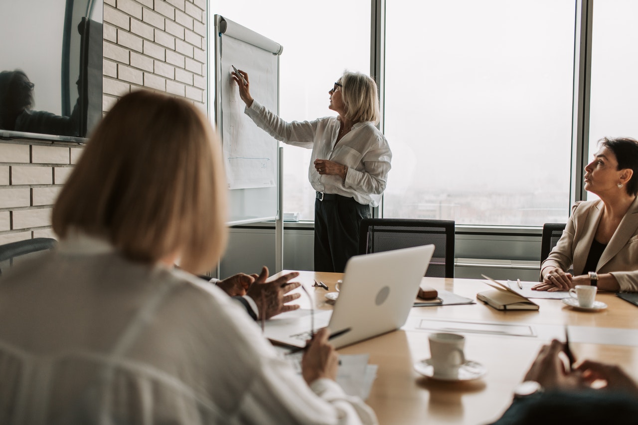 Photo of a team of three people working on a compensation plan