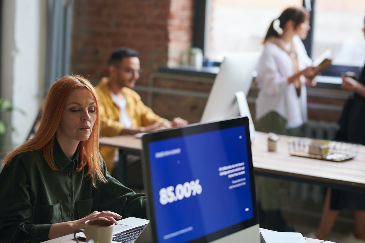 Photo of several workers at an office