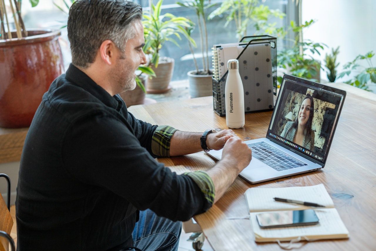 A photo of a remote learner in a one-on-one meeting.