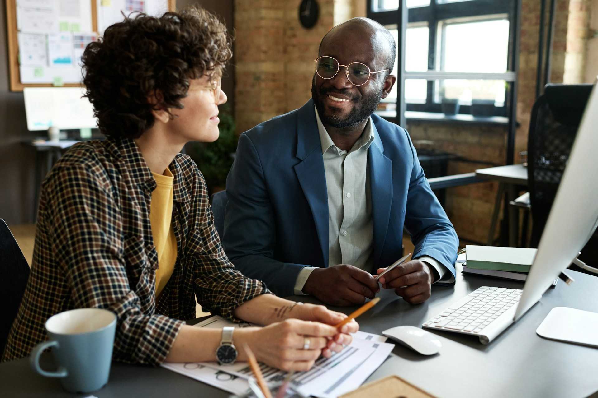 A photo of two company leaders in discussion.