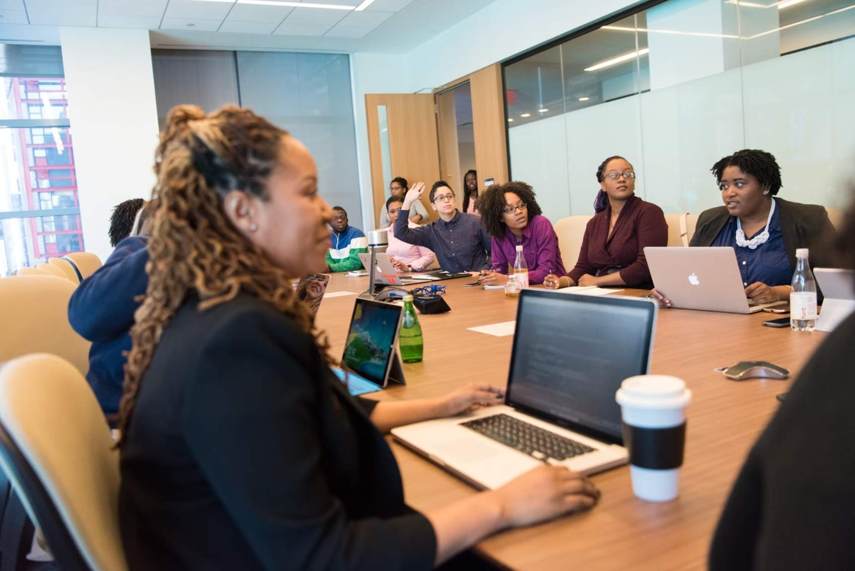 Photo of a group of professionals gathered together in a meeting room